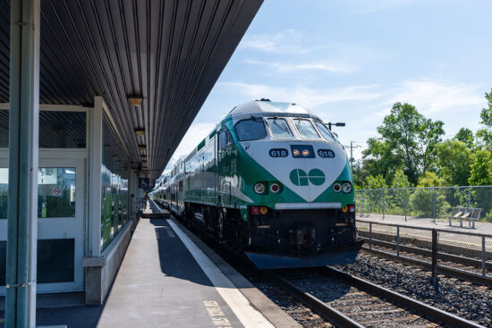 Photo of GO Train at station on a sunny day