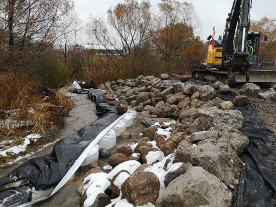 Rocks placed to assist in erosion mitigation along the banks of Joshua creek